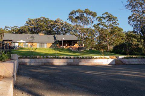 Finished sandstone retaining wall and turfed terrace below the house, Kenthurst