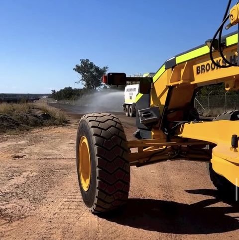 Grader and water truck working a remote haul road, Blue Mountains NSW