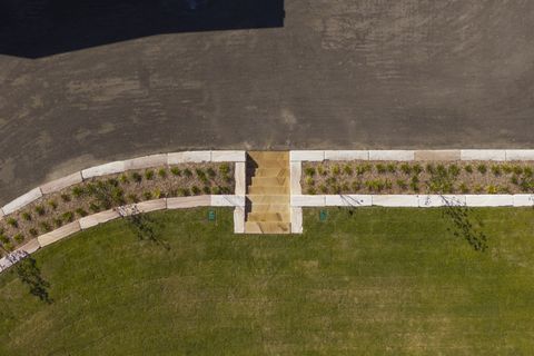 Top-down view of the sandstone steps, garden bed and gravel car park edge