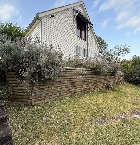 Leaning timber sleeper wall before replacement