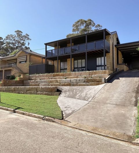 Two-tier sandstone driveway wall completed